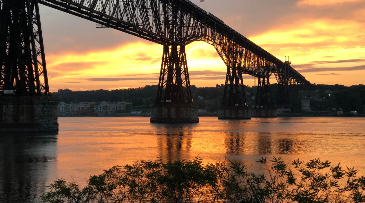 Walkway Over the Hudson, Poughkeepsie, at sunset with the gray and orange sky reflecting on the Hudson River